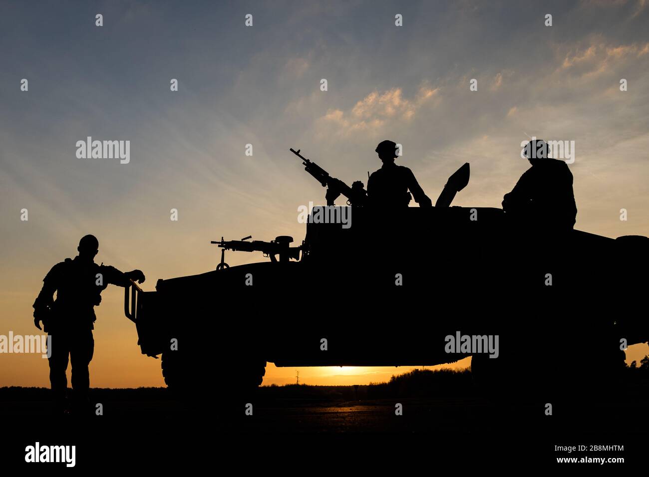 Three Air Force Airmen standing bye for orders to man there post and defend the base. Stock Photo