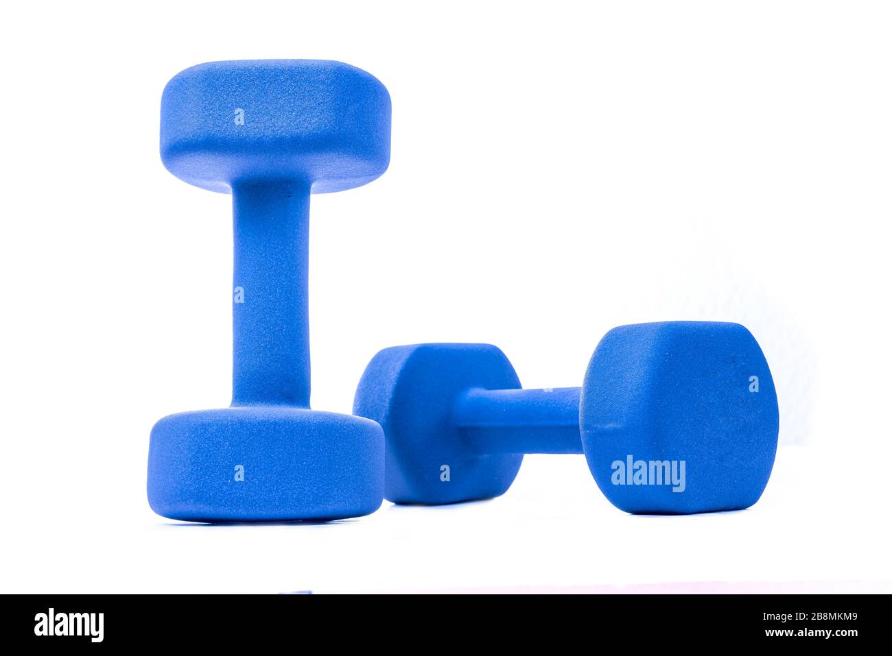 A pair of blue dumbbells isolated on white background Stock Photo