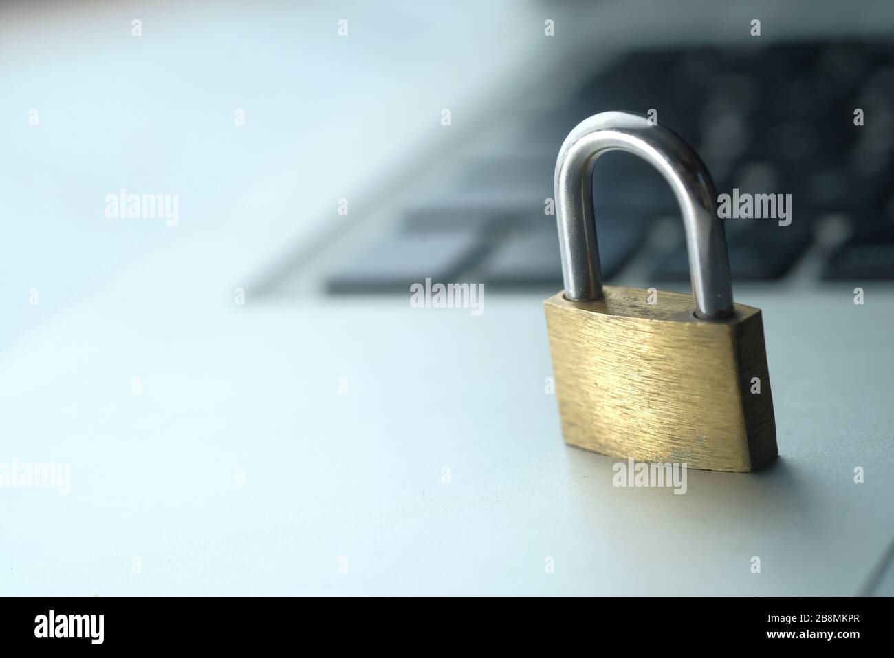 Cyber safety concept, locked and key on laptop computer keyboard Stock Photo Alamy