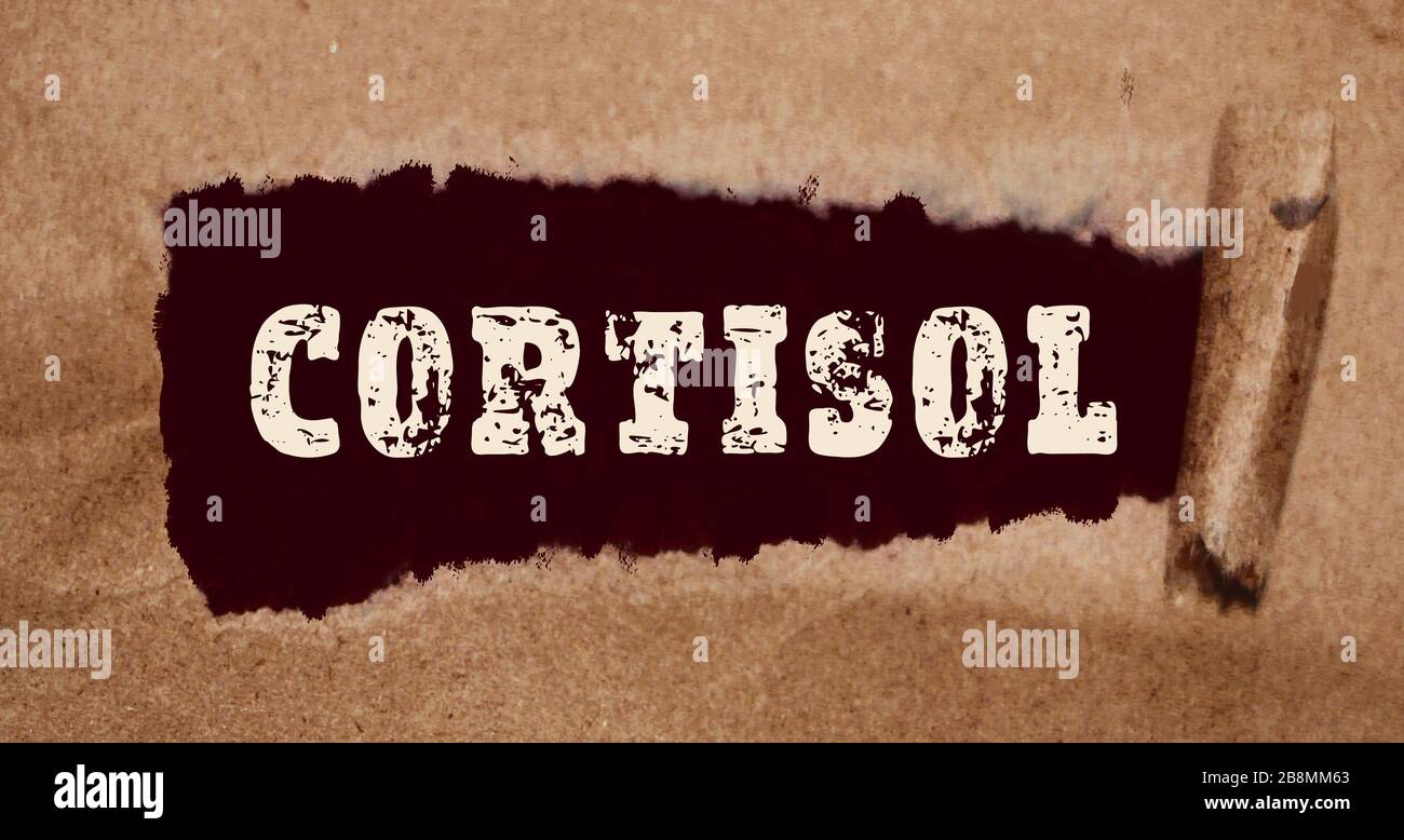Cortisol word under torn paper. Stress responce concept Stock Photo