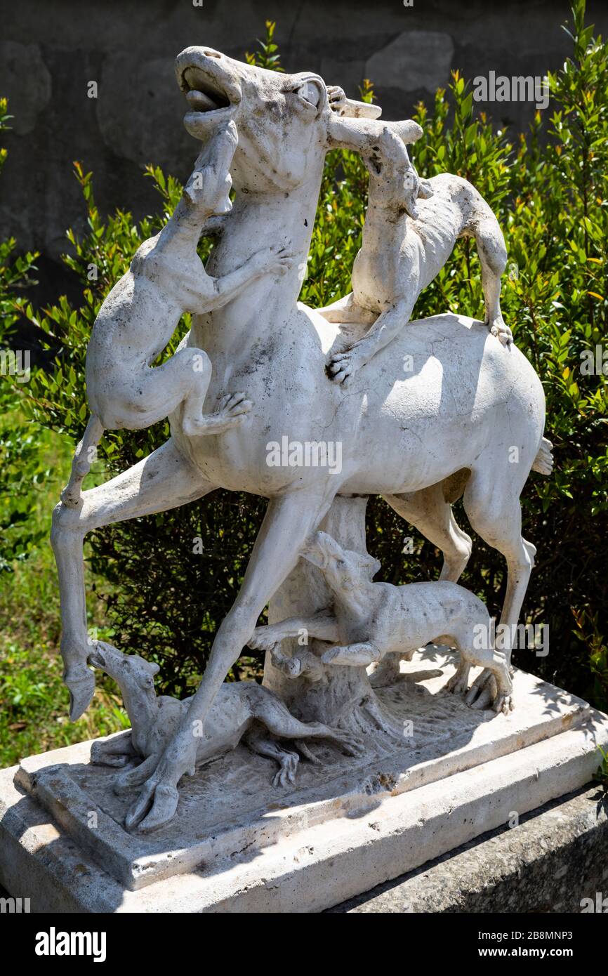 Statue of a deer being attacked by dogs, House of the Stags, Herculaneum, Campania, Italy. Stock Photo