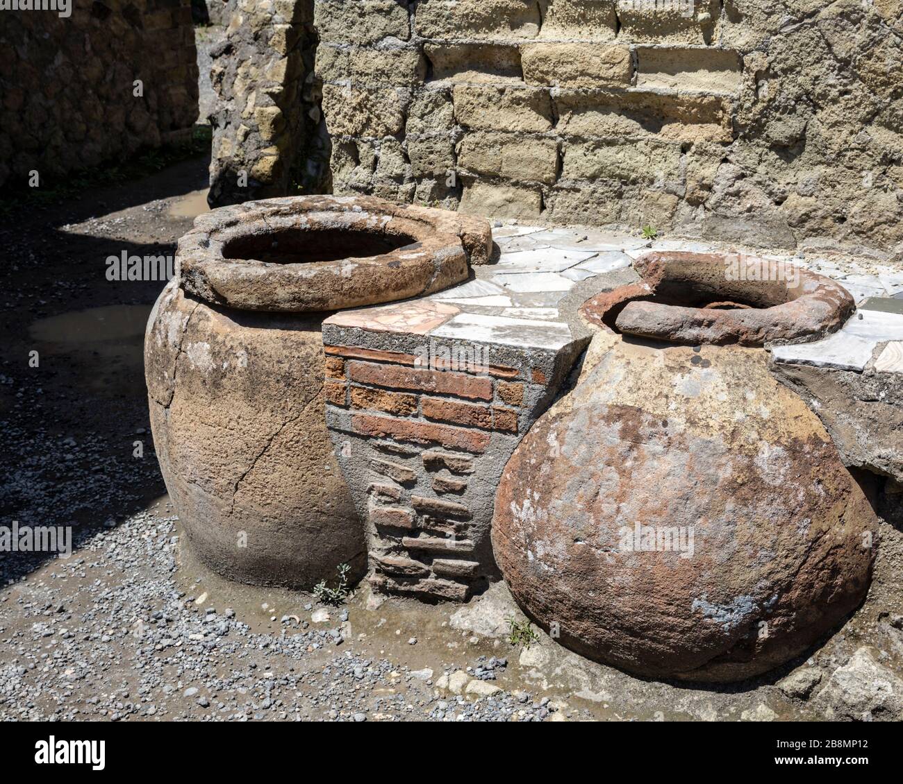 Two exposed food storage containers in the remains of a Roman food outlet, Herculaneum, Campania, Italy. Stock Photo