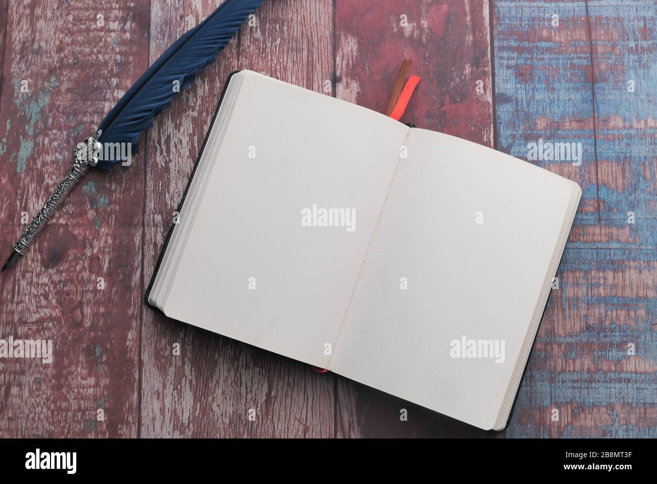 open notebook and fountain pen on table Stock Photo