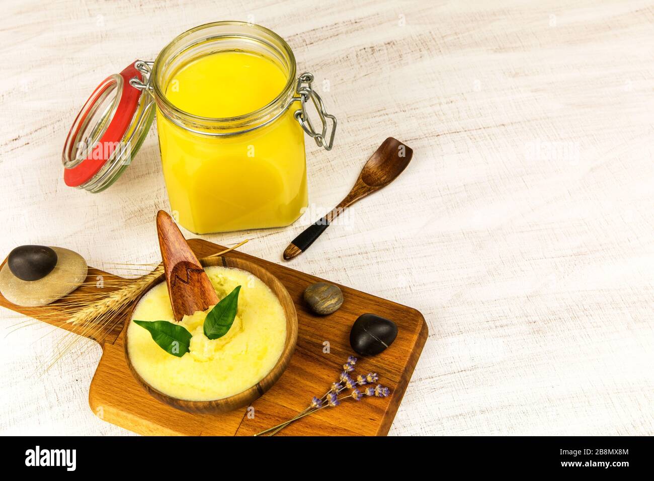 Ghee or clarified butter in jar. Healthy eating and using organic fresh