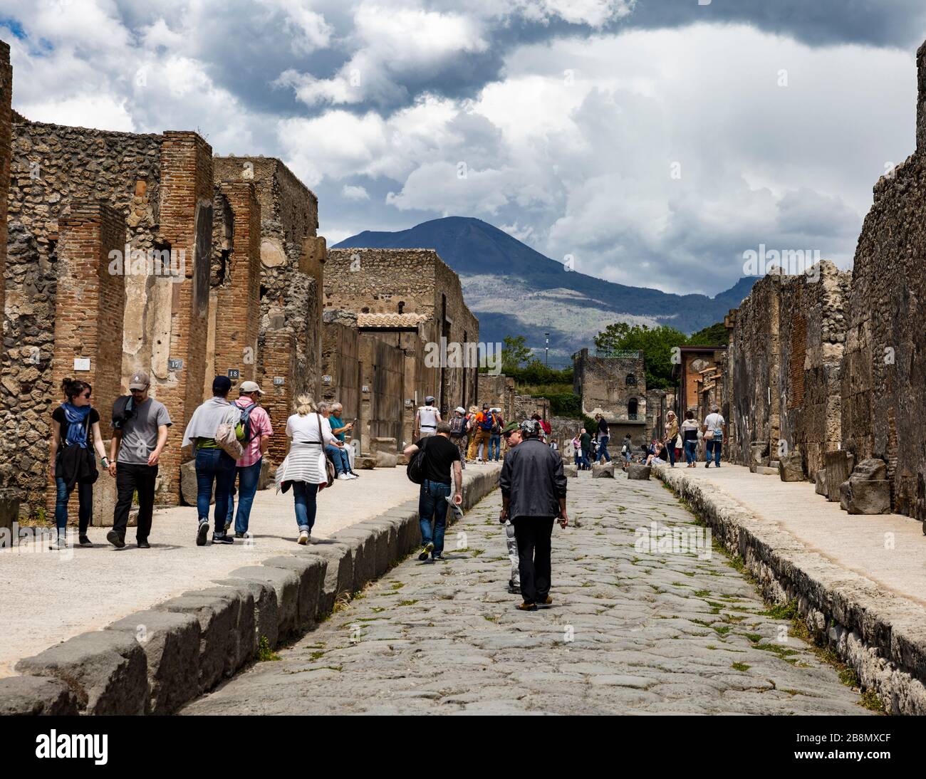 Tourists exploring the ruins of Pompeii, Campania, Italy. Stock Photo
