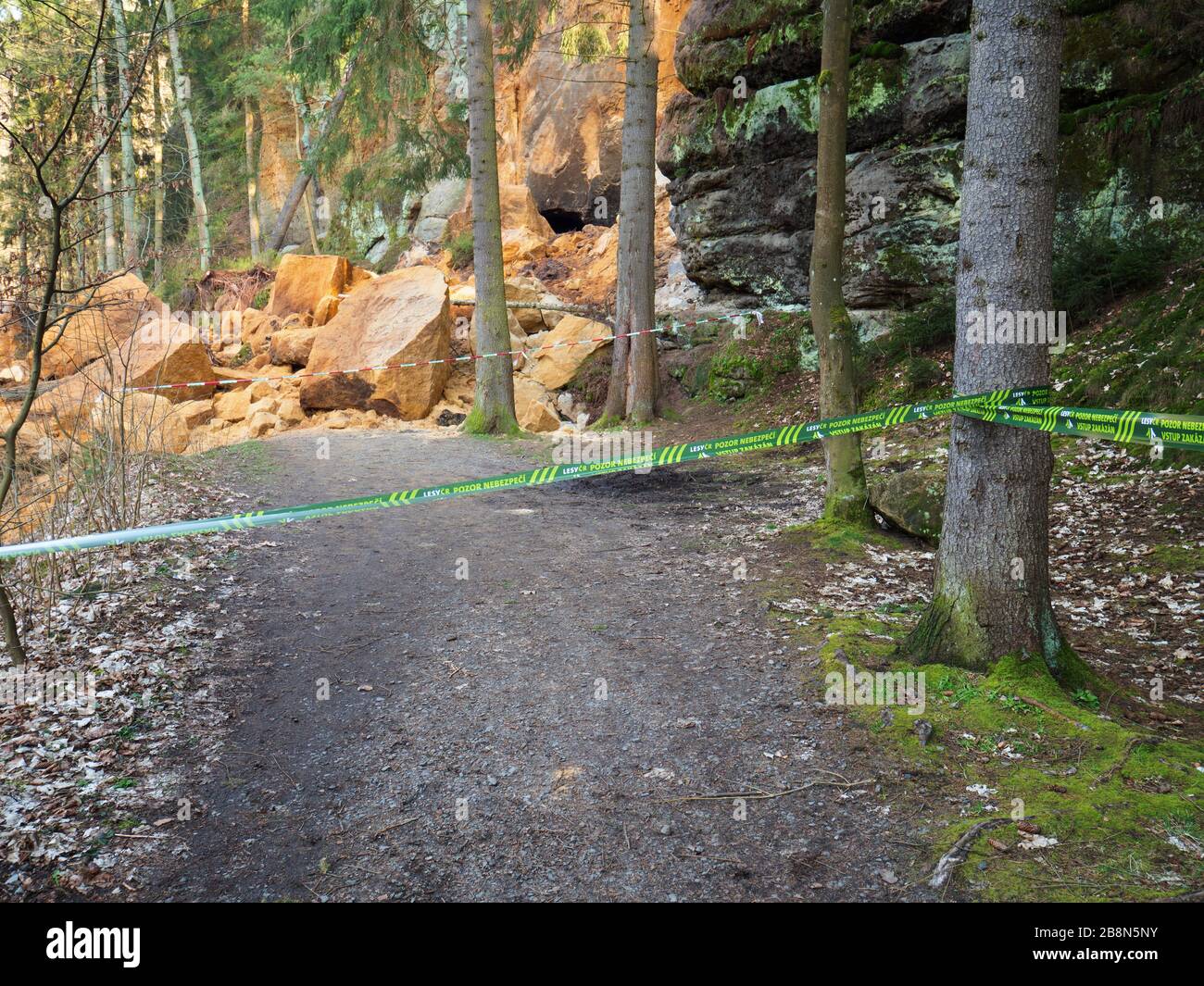 Falling rocks area, closed zone. On the background closed road due ...