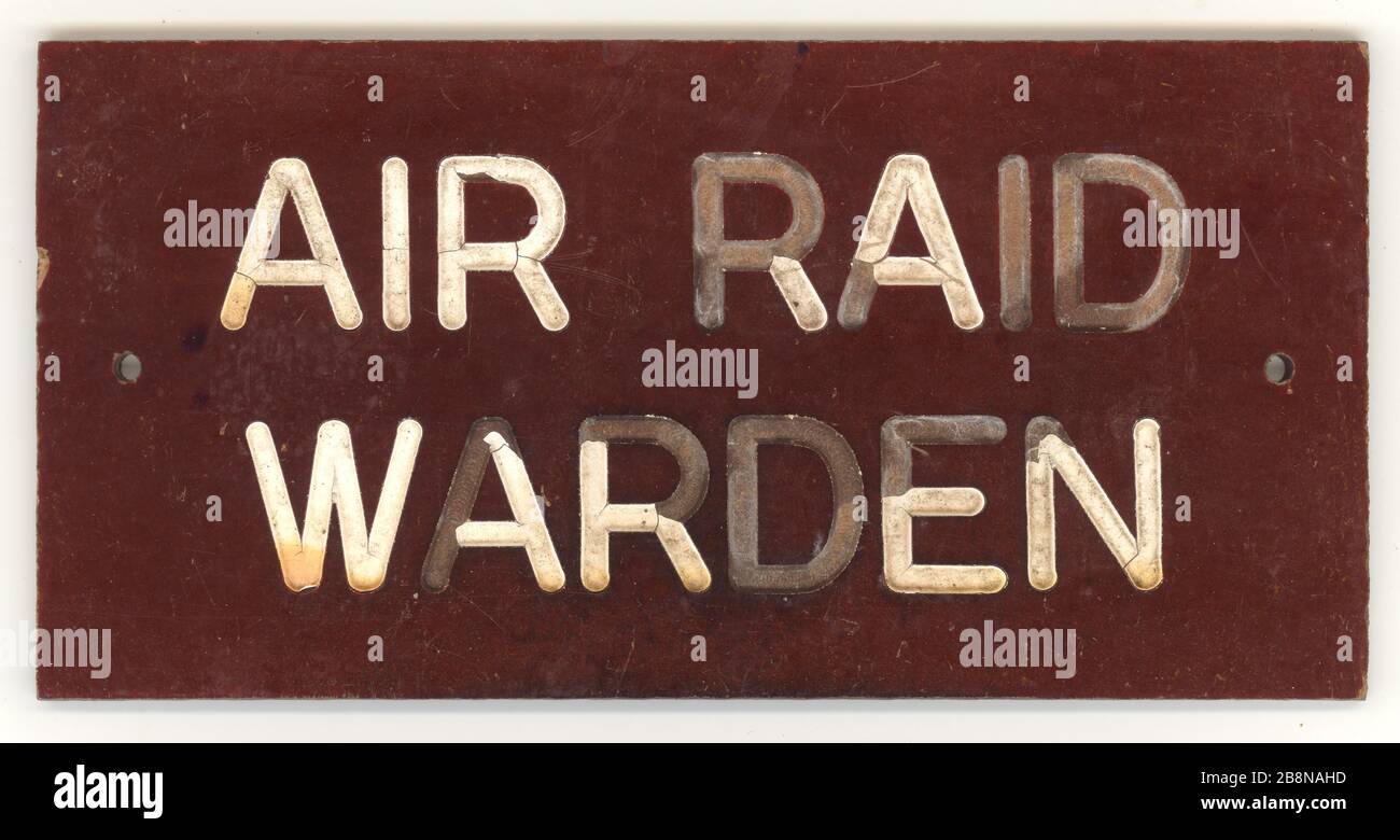 Original World War 2 era, air raid warden door sign with faded lettering, made from Bakelite, Britain, U.K., circa 1940's. Stock Photo