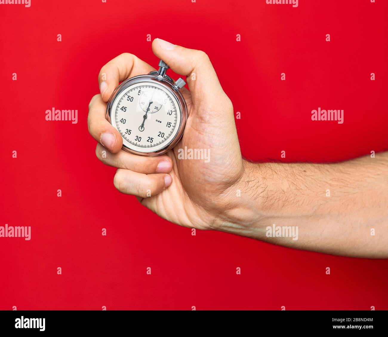 Beautiful hand of man holding stopwatch doing countdown over isolated ...