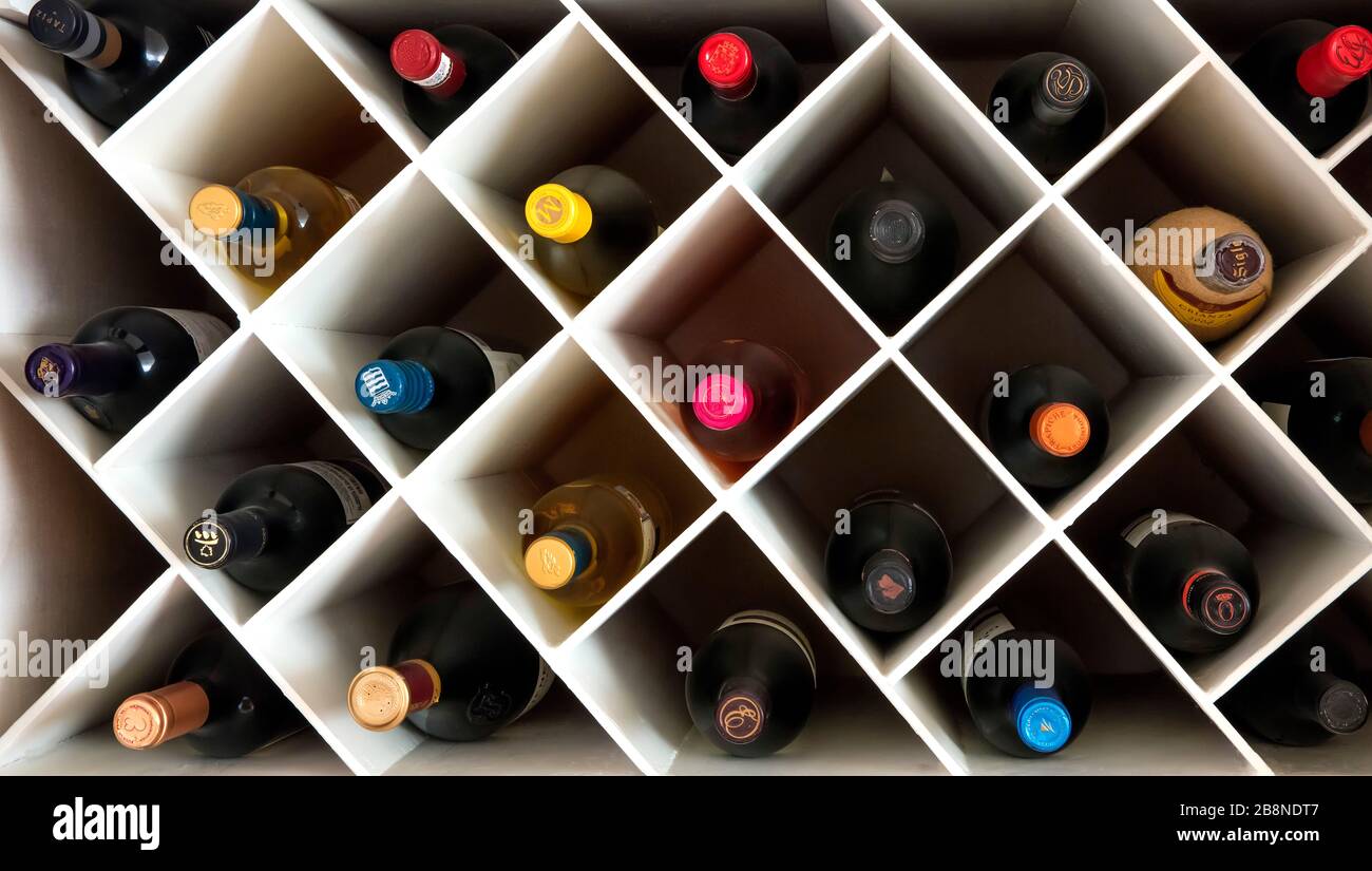 White wine rack with bottles Stock Photo