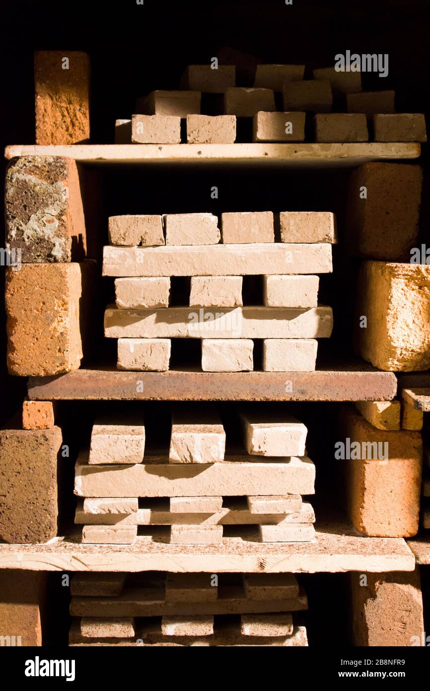 ceramic design tile after wood firing cools in an open oven Stock Photo