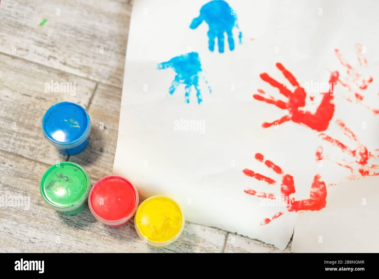 Children making handprints with paint hires stock photography and