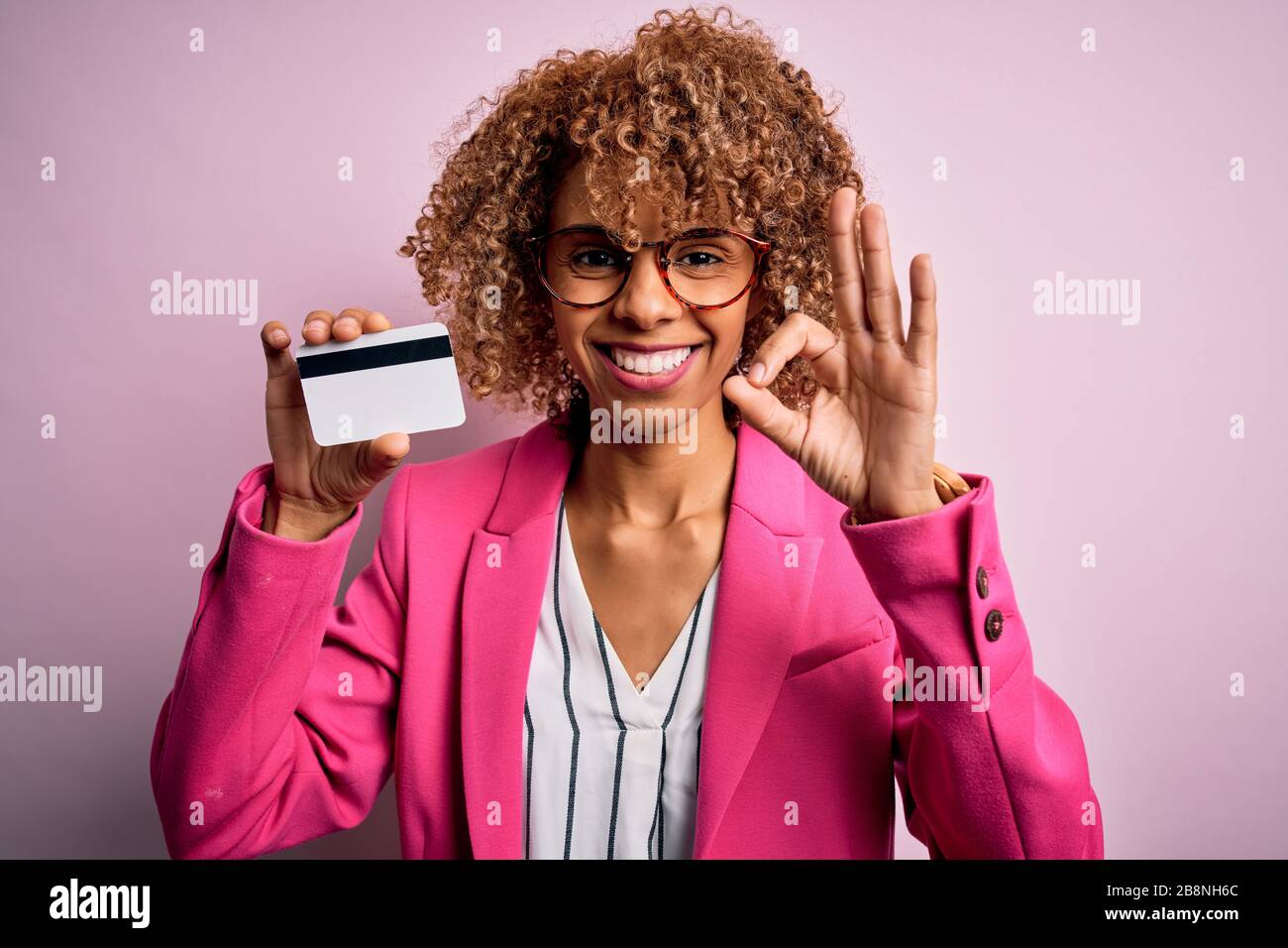 Young african american business woman holding id card identification