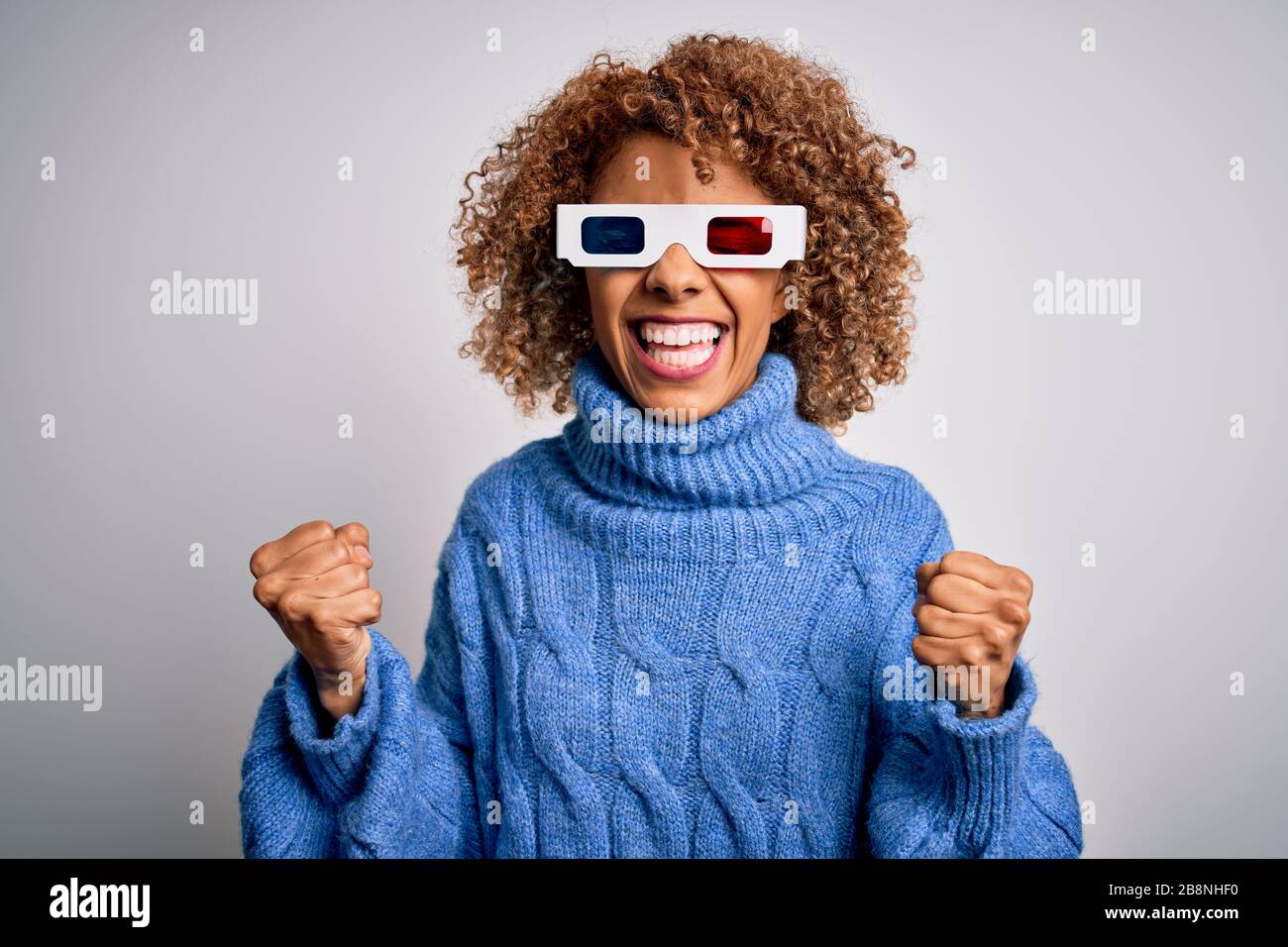 Young african american curly woman wearing 3d glasses over isolated ...