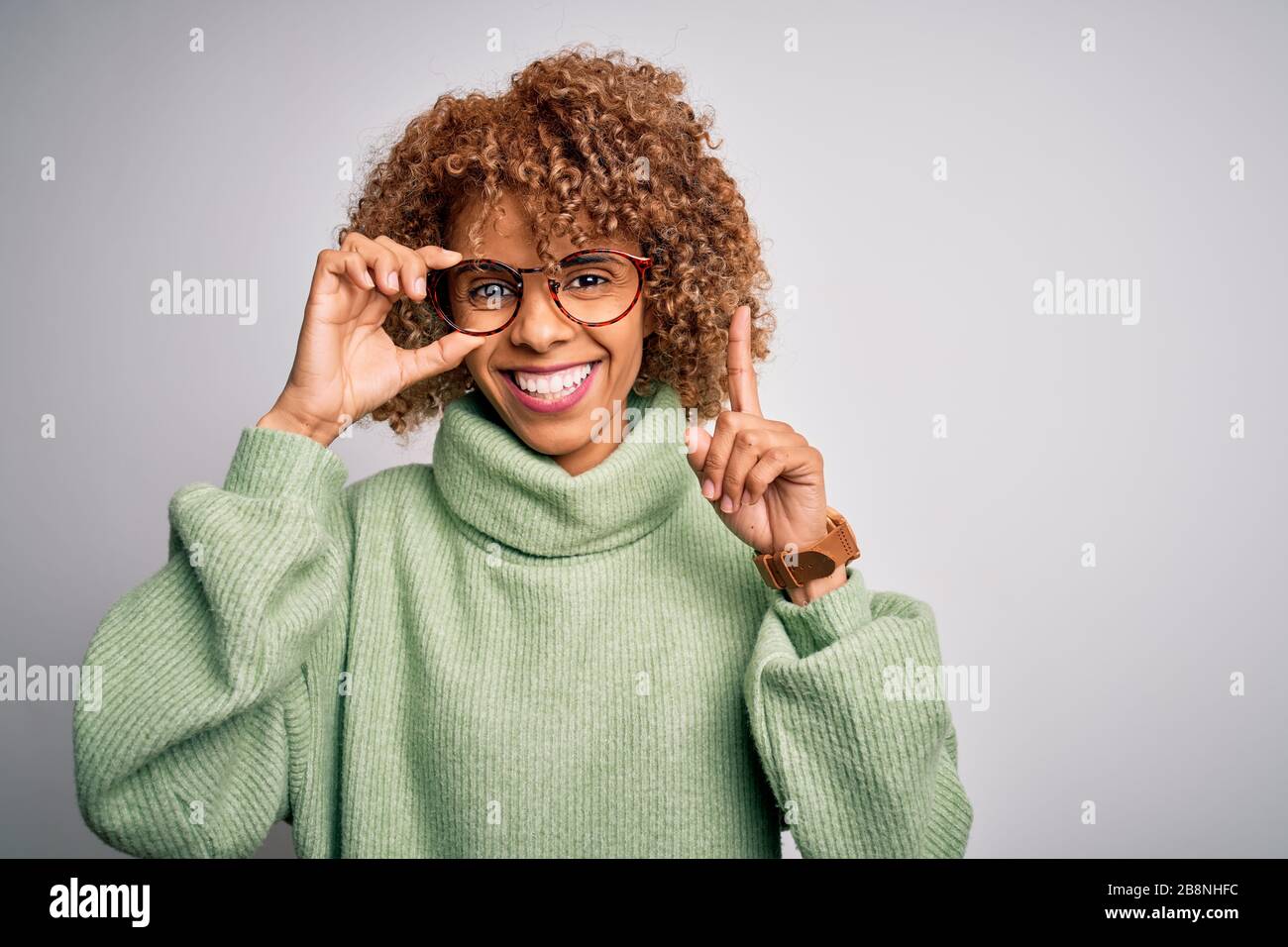 African american optical woman with curly hair wearing glasses over ...