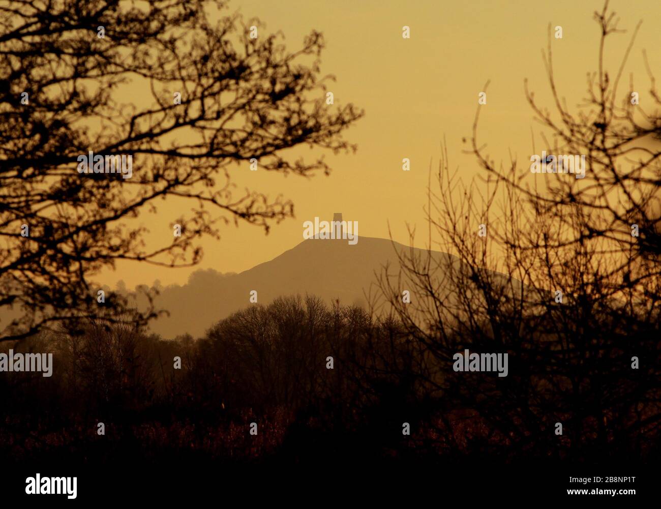 The sun rises across the Somerset levels near Glastonbury. Stock Photo