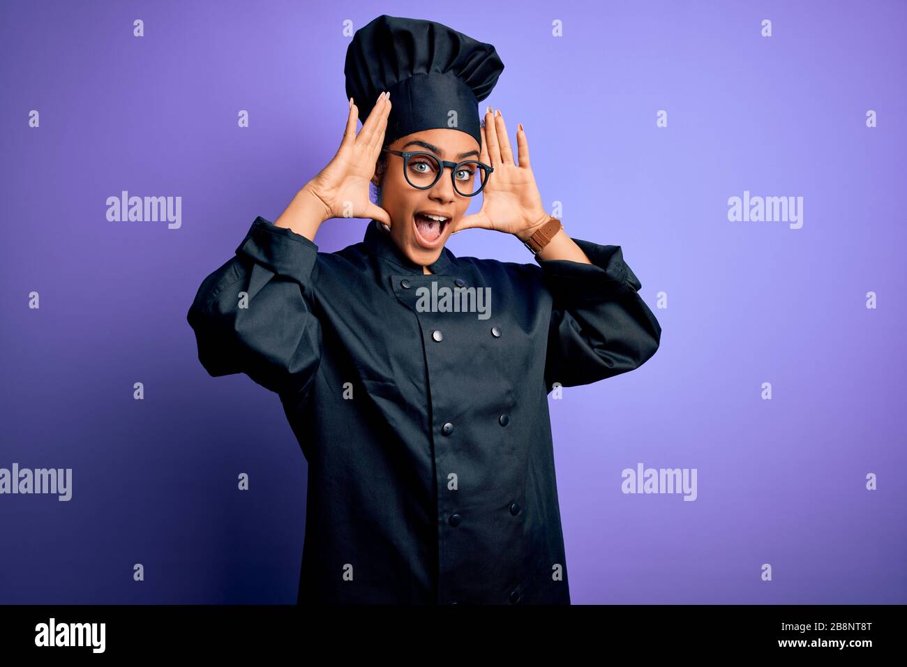 Young african american chef girl wearing cooker uniform and hat over ...