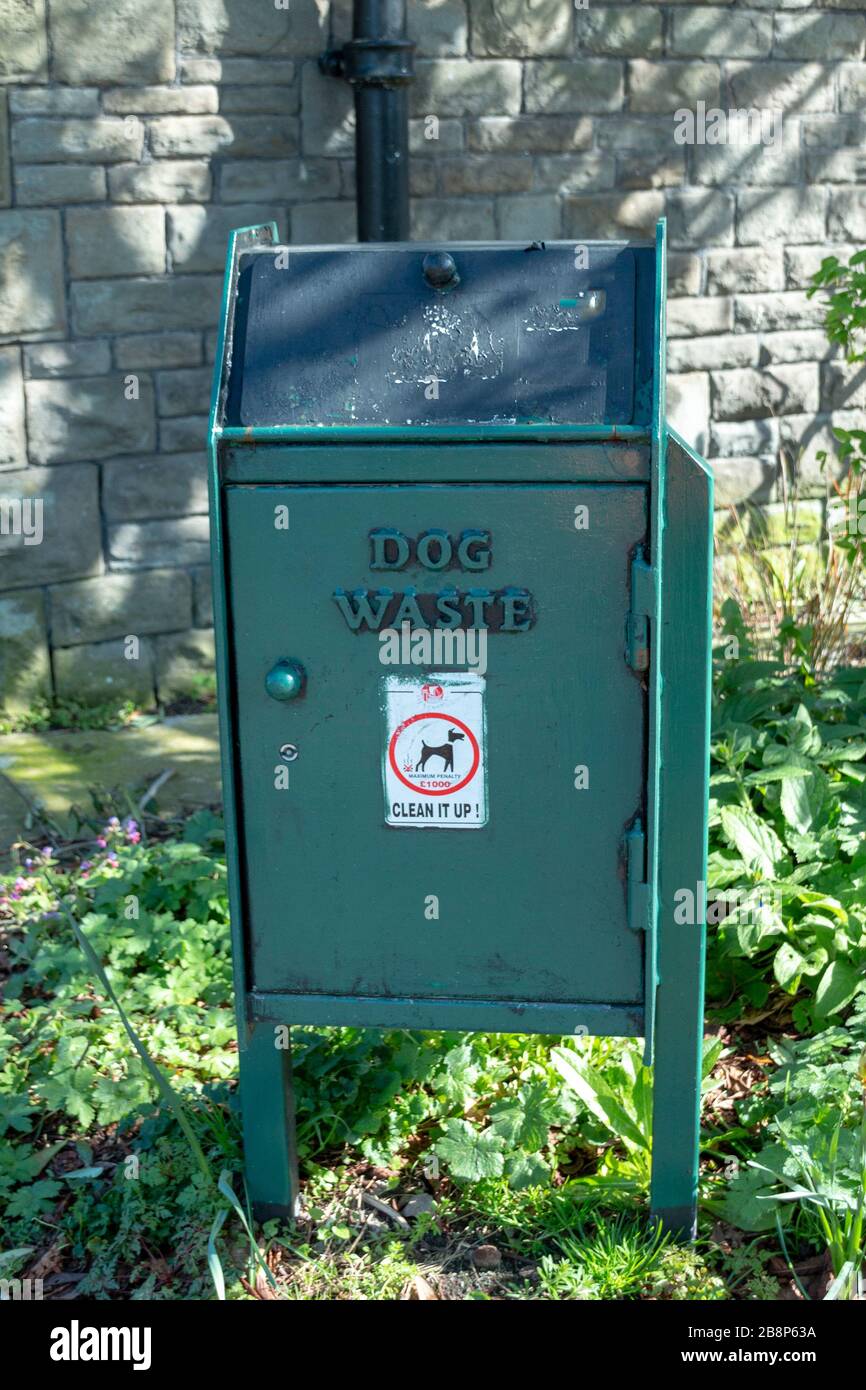 a close up view of a dog waste bin for pet owners to out the dogs poop in Stock Photo Alamy