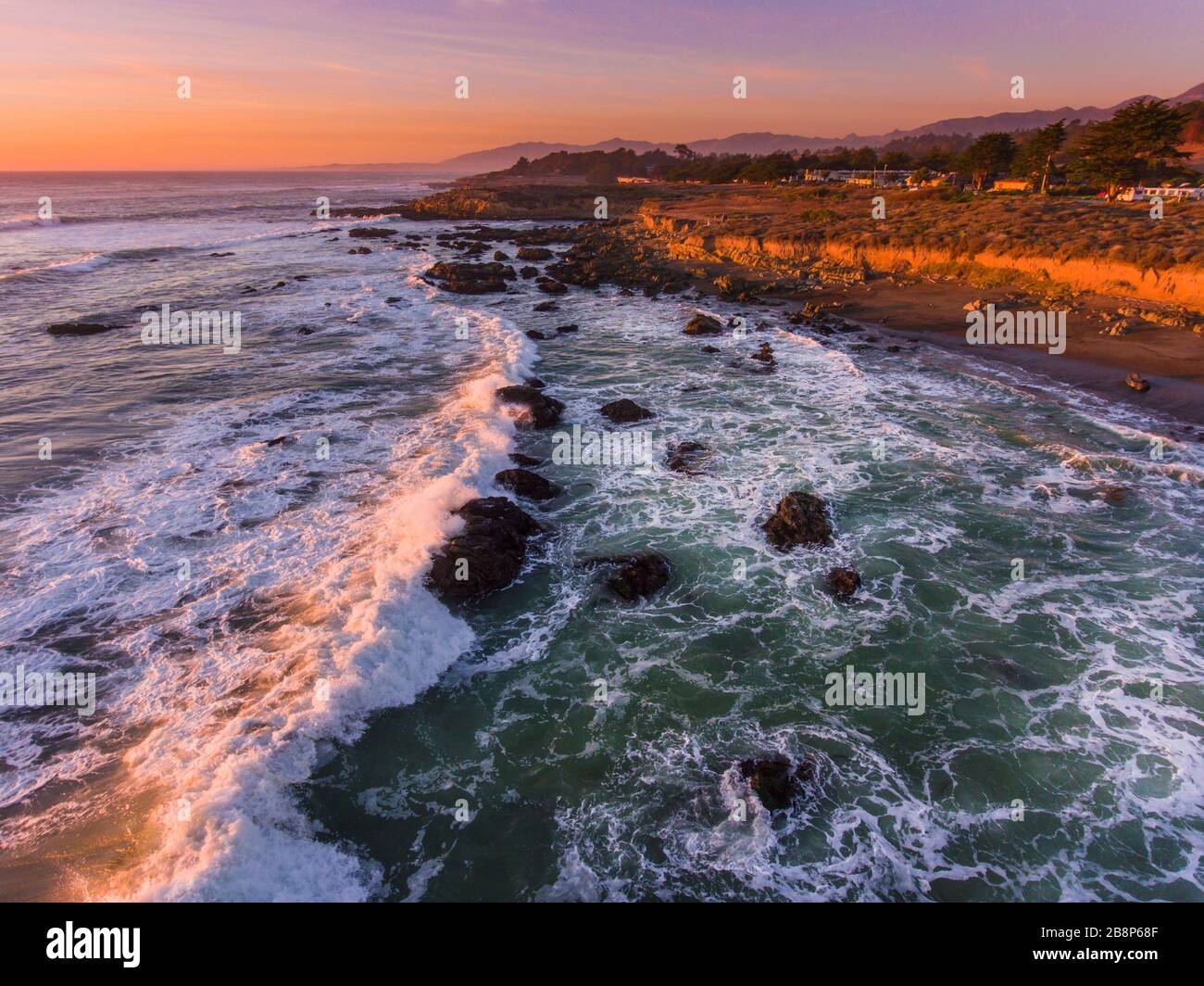 Aerial view of sunset and headlands along California coast. Stock Photo