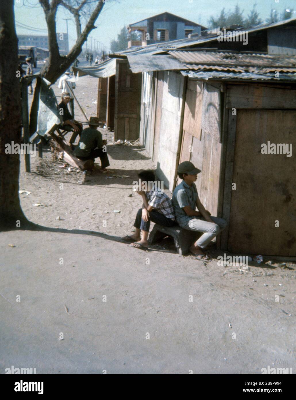 1968, Vietnam   Civilian Vietnamese children near a hut building in the Danang area. Stock Photo