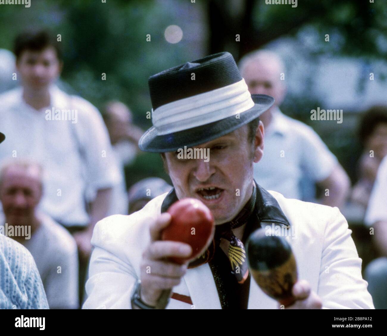 1968, Vietnam War Protest   Man singing and shaking maracas in Washington Square Park. Stock Photo