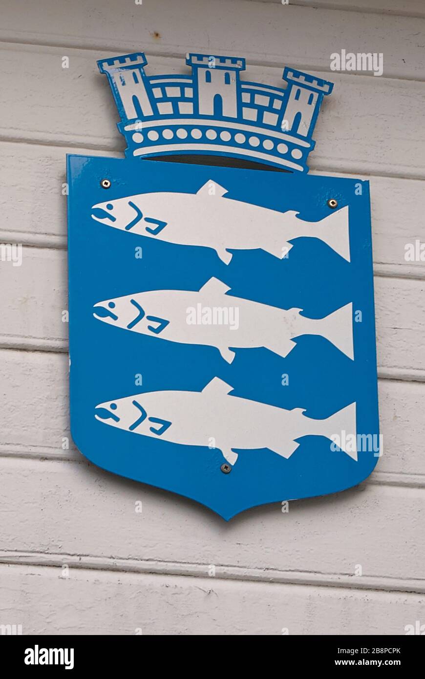 The coat of arms of the small Norwegian town Mandal, which historically owed its welfare from the salmons in the Mandalselva river Stock Photo