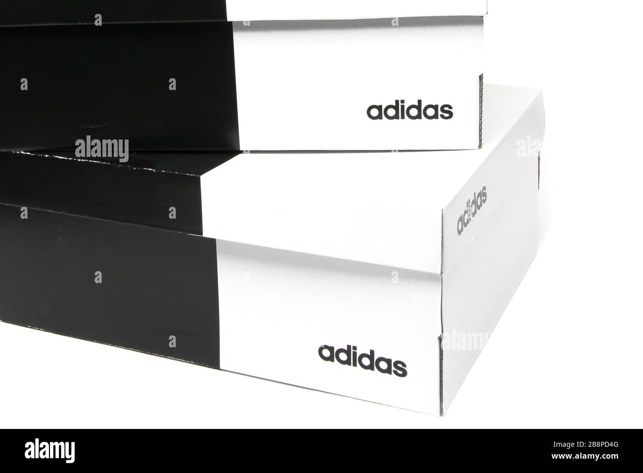 Two shoes box are isolated on a white background. Adidas boxes for sneakers. San Francisco, USA, March 2020 Stock Photo