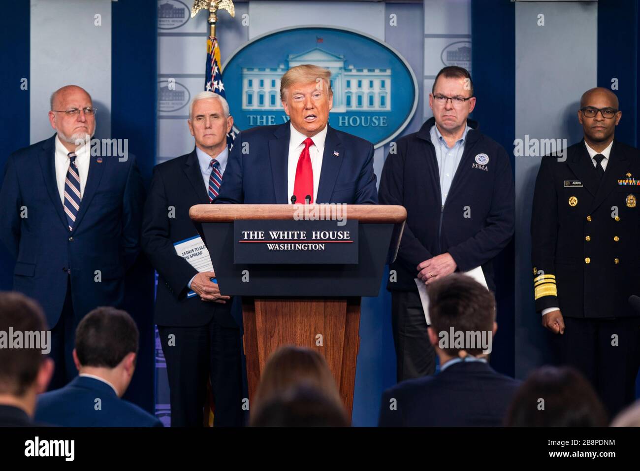 United States President Donald J. Trump speaks during the daily briefing on the Coronavirus Pandemic from the Brady Press Briefing Room if the White House in Washington, DC on Sunday, March 22, 2020. Standing behind the President, from left to Right: Director of the Centers for Disease Control and Prevention Dr. Robert Redfield; US Vice President Mike Pence; Pete Gaynor, Administrator, Federal Emergency Management Agency (FEMA); and US Surgeon General Vice Admiral (VADM) Jerome M. Adams, M.D., M.P.H.Credit: Jim LoScalzo/Pool via CNP | usage worldwide Stock Photo