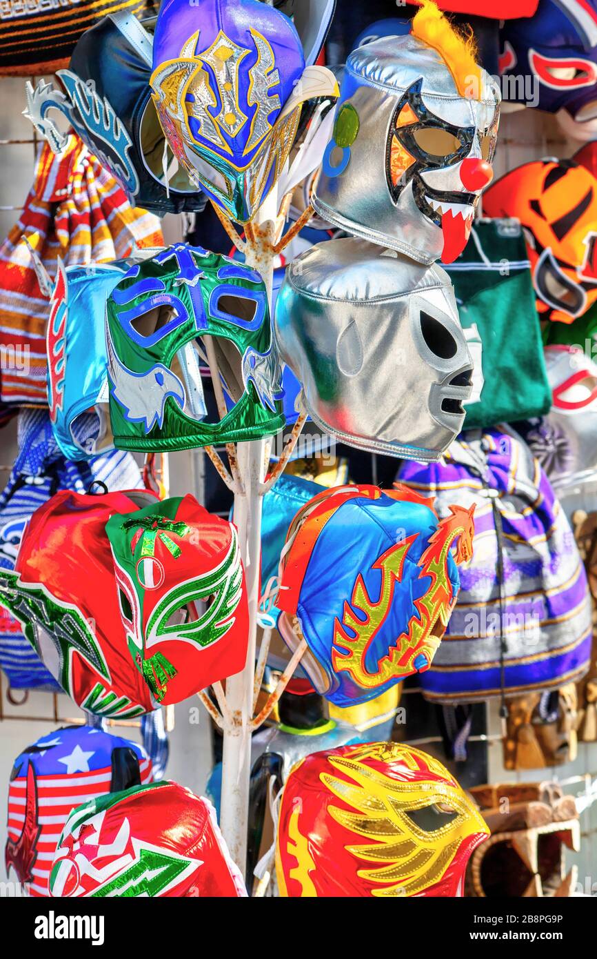 Hanging colorful Mexican Lucha Libre wrestling masks on sale at a tourist souvenir shop on 5th Avenue Playa del Carmen in Riviera Maya, Cancun, Mexico Stock Photo