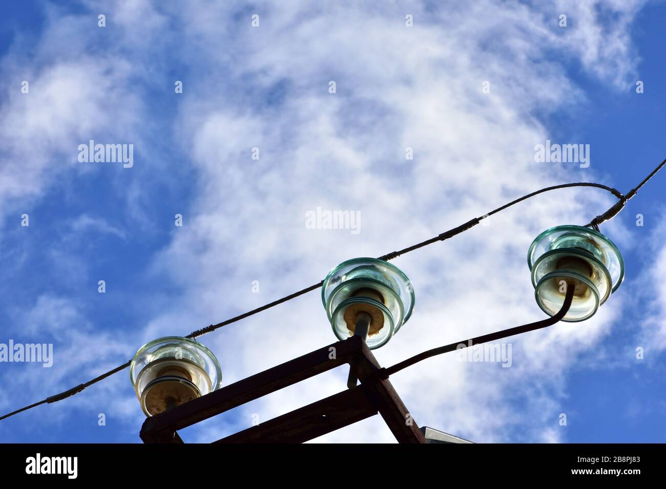 tower and high voltage lines with glass insulators Stock Photo - Alamy