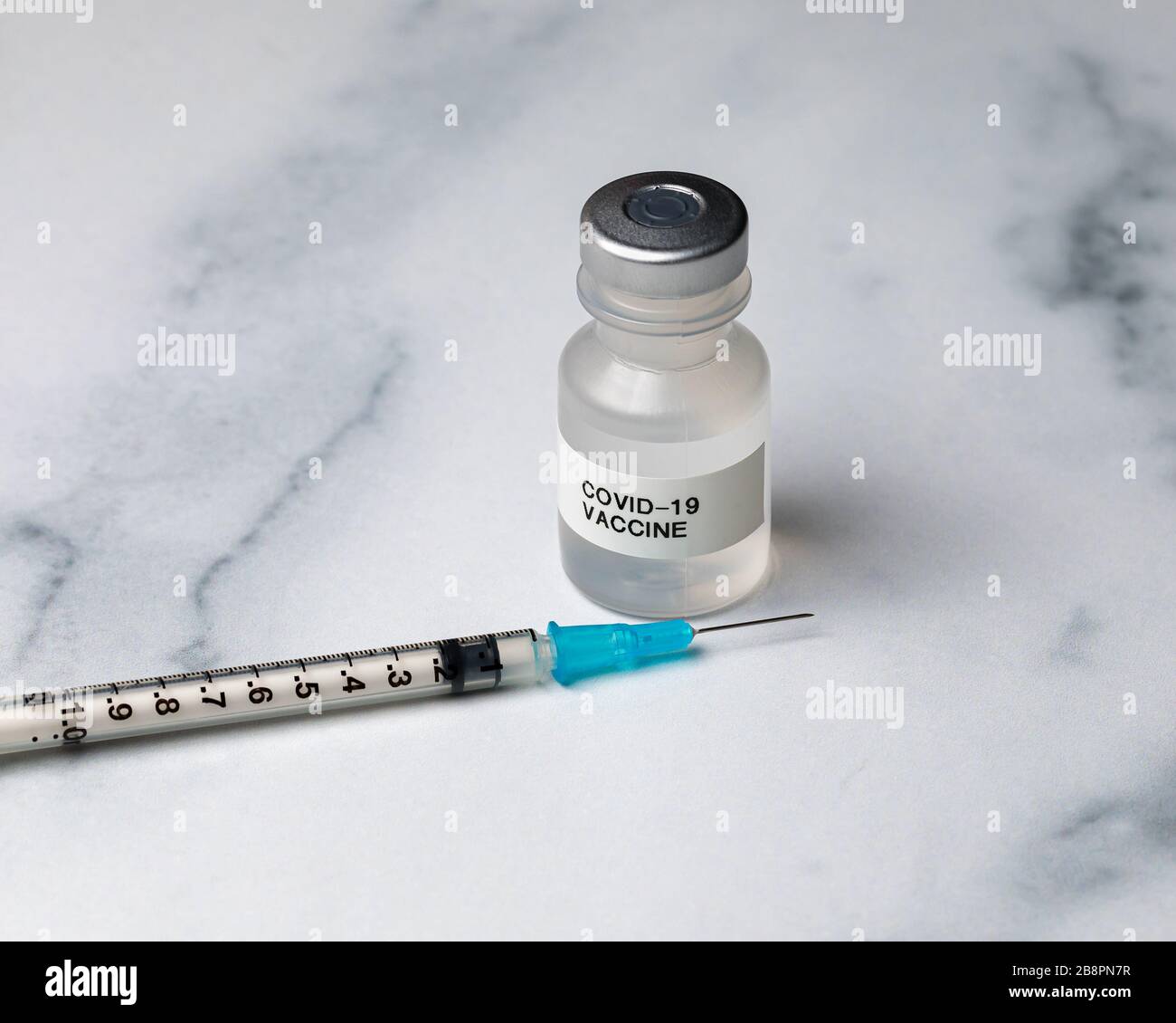 Concept of Covid-19 coronavirus drug vaccine. Medicine vial with needle syringe Stock Photo