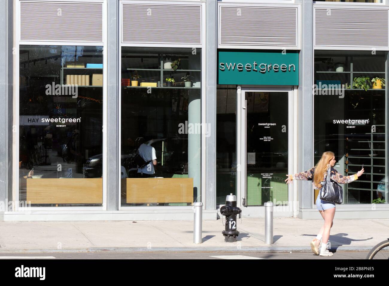 sweetgreen, 347 Bowery, New York, NY. exterior storefront of a fast casual salad chain in NoHo. Stock Photo