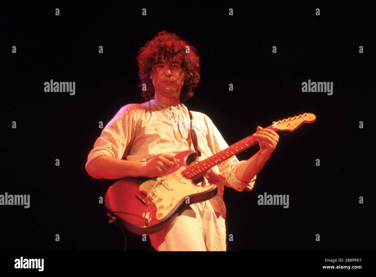 DETROIT - MAY 2: The Firm, including former lead guitarist for Led Zeppelin, Jimmy Page, and former lead singer for Free and Bad Company, Paul Rodgers, perform on May 2, 1986, at the Joe Louis Arena in Detroit, Michigan. Credit: Ross Marino Archive / MediaPunch Stock Photo