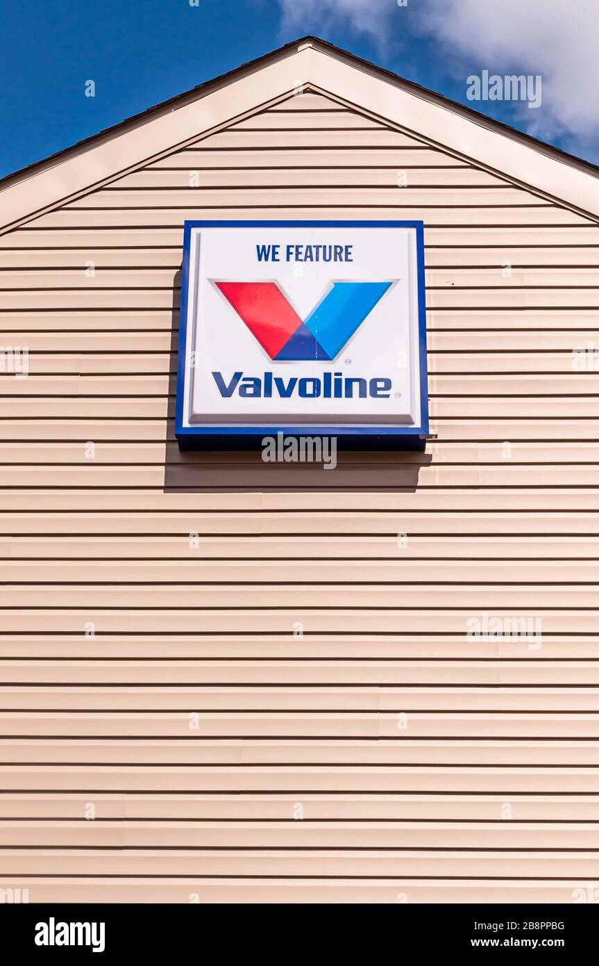 A We Feature Valvoline sign on the side of a building. Valvoline is a maker and supplier of oil used in engines and is used internationally Stock Photo