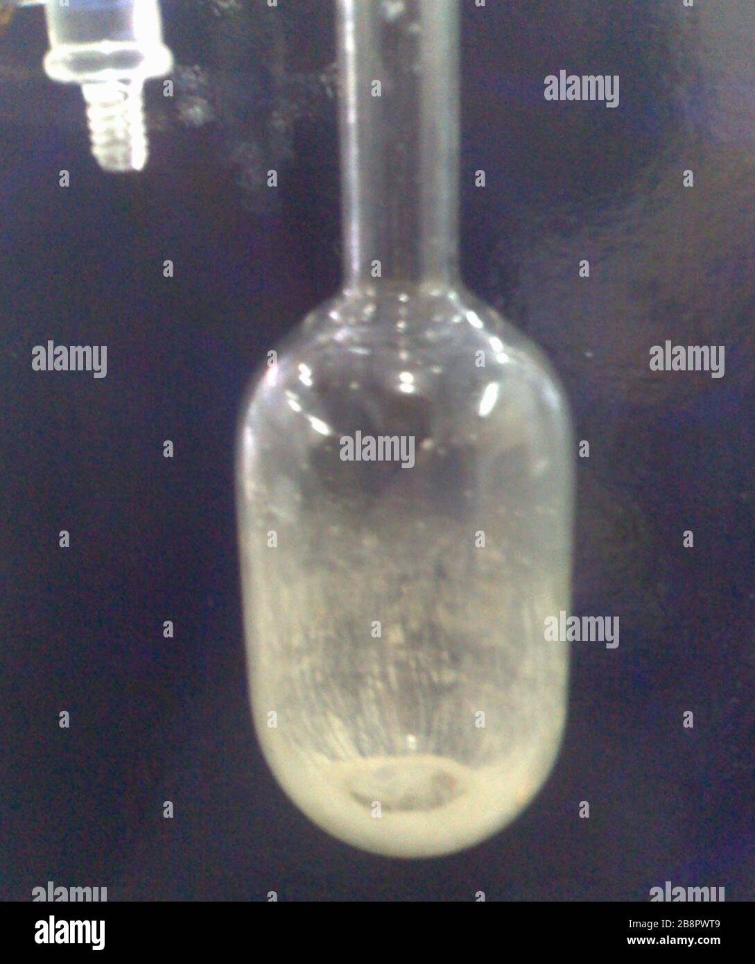 English: 1,3-dimesitylimidazol-2-ylidene in a Schlenk flask; 28 April 2008  (original upload date); Transferred from en.wikipedia to Commons by  omegakent.; Freestyle-69 at English Wikipedia Stock Photo - Alamy