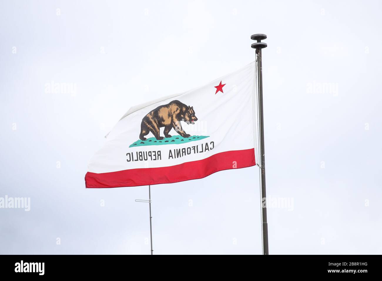 Burbank, California, USA. 22nd March, 2020. Flag of California Republic at Warner Bros. Studios in Burbank, temporarily closed in response to coronavirus COVID-19 pandemic, three days after the 'Safer at Home' order issued by both Los Angeles Mayor Eric Garcetti at the county level and California Governor Gavin Newsom at the state level on Thursday, March 19, 2020 which will stay in effect until at least April 19, 2020 amid the Coronavirus COVID-19 pandemic United States. Credit: Image Press Agency/Alamy Live News Stock Photo