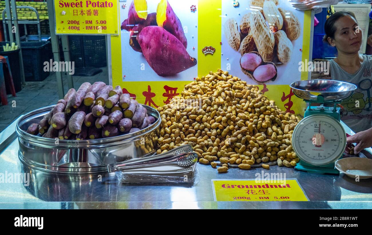 Food stall selling sweet potatoes and peanuts in Jalan Alor popular