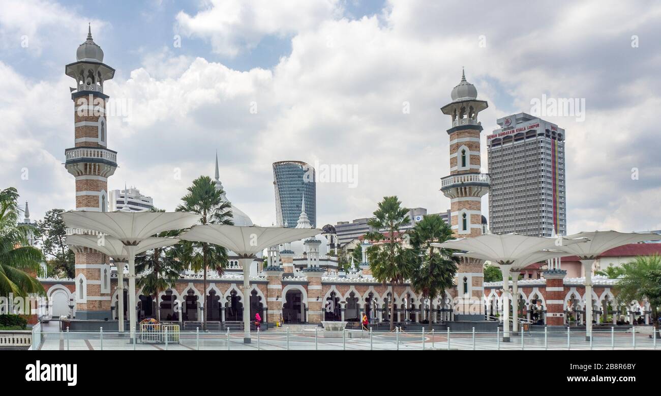 Sultan Abdul Samad Jamek Mosque and minarets DBKL 1 Tower and KKR2 Tower City Centre Kuala Lumpur Malaysia. Stock Photo