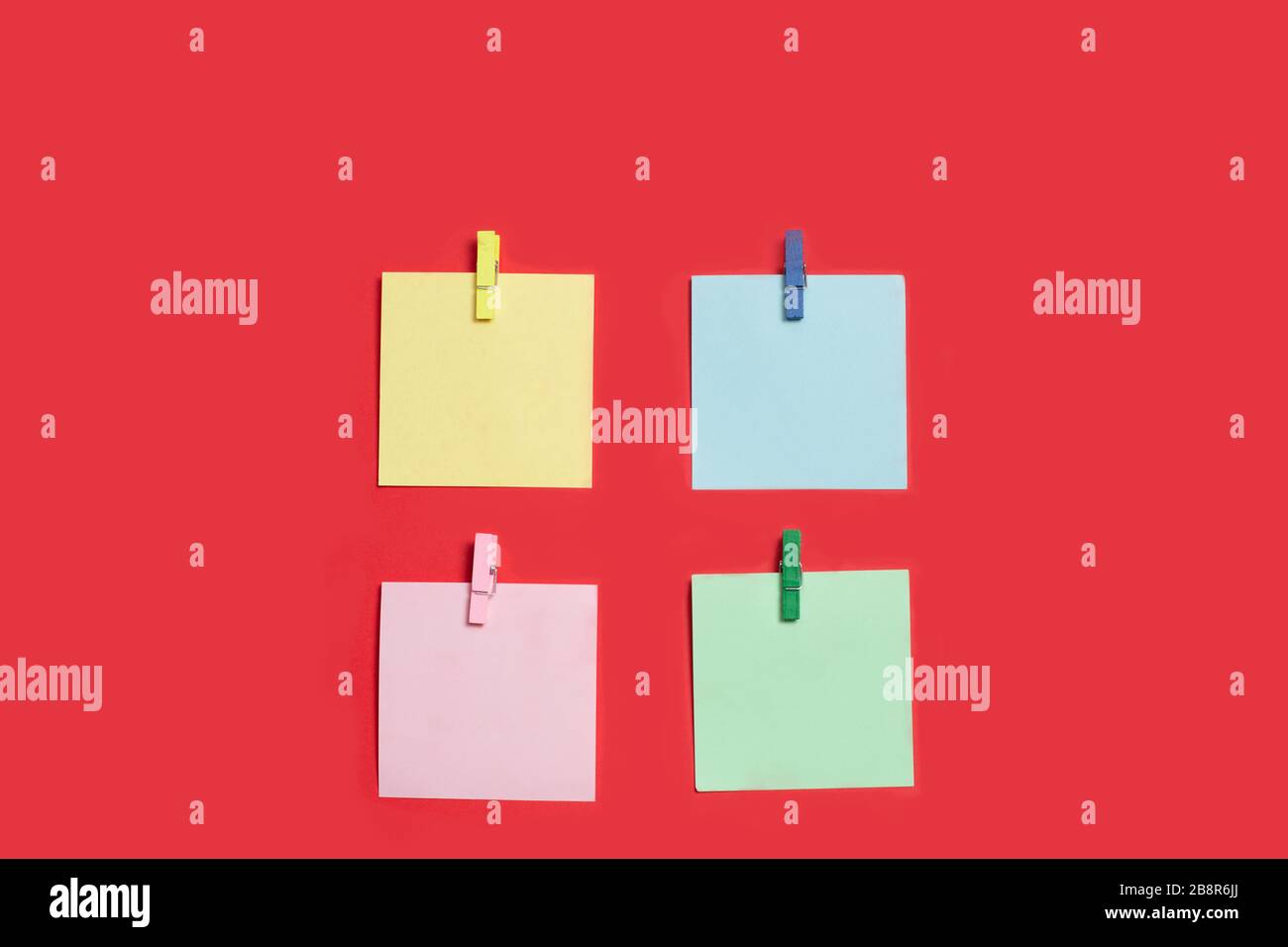 Reminder multicolored stickers on a red background Stock Photo