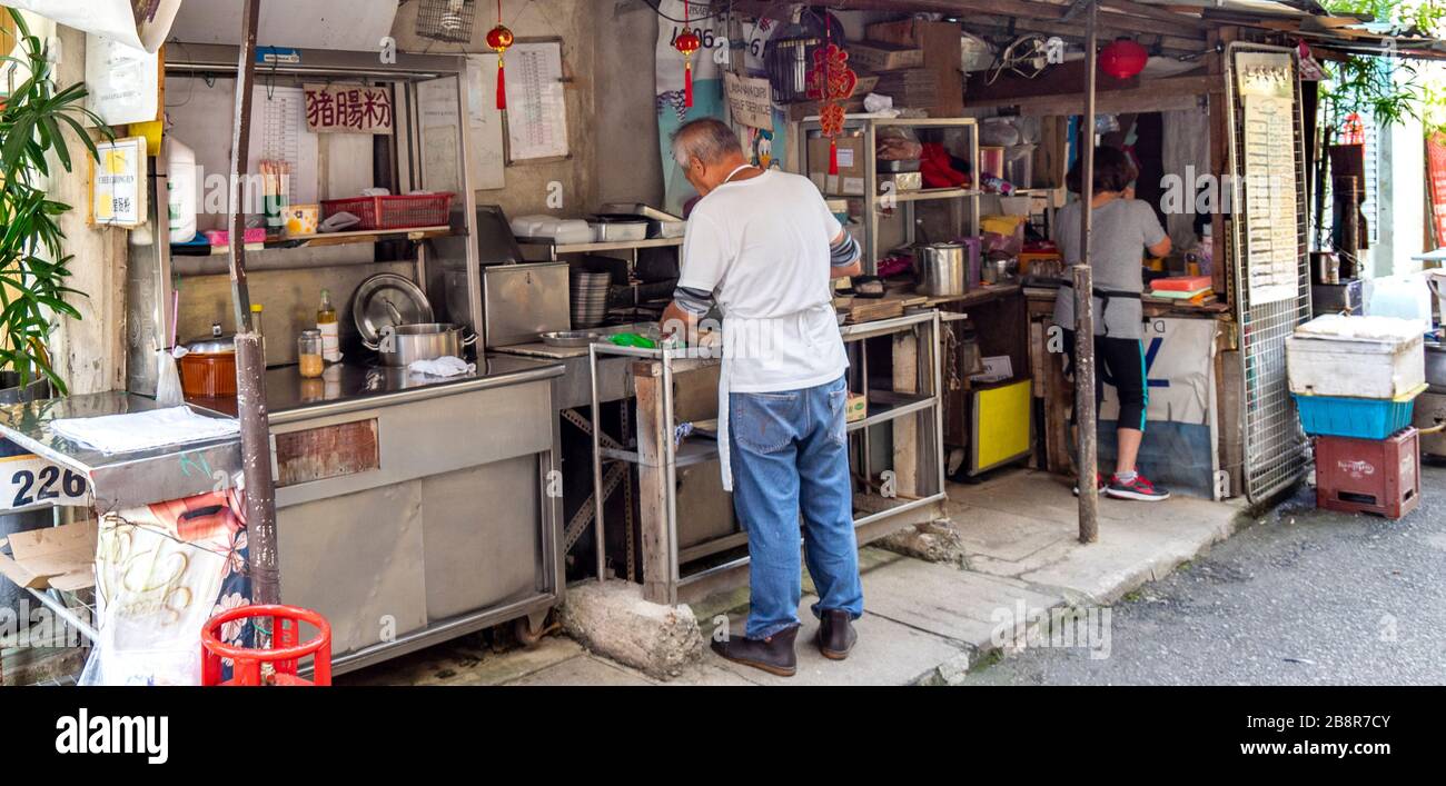 Male Cook Preparing Food In Outdoor Kitchen Of Restaurant In Laneway Lorong Panggung Chinatown City Centre Kuala Lumpur Malaysia Stock Photo Alamy