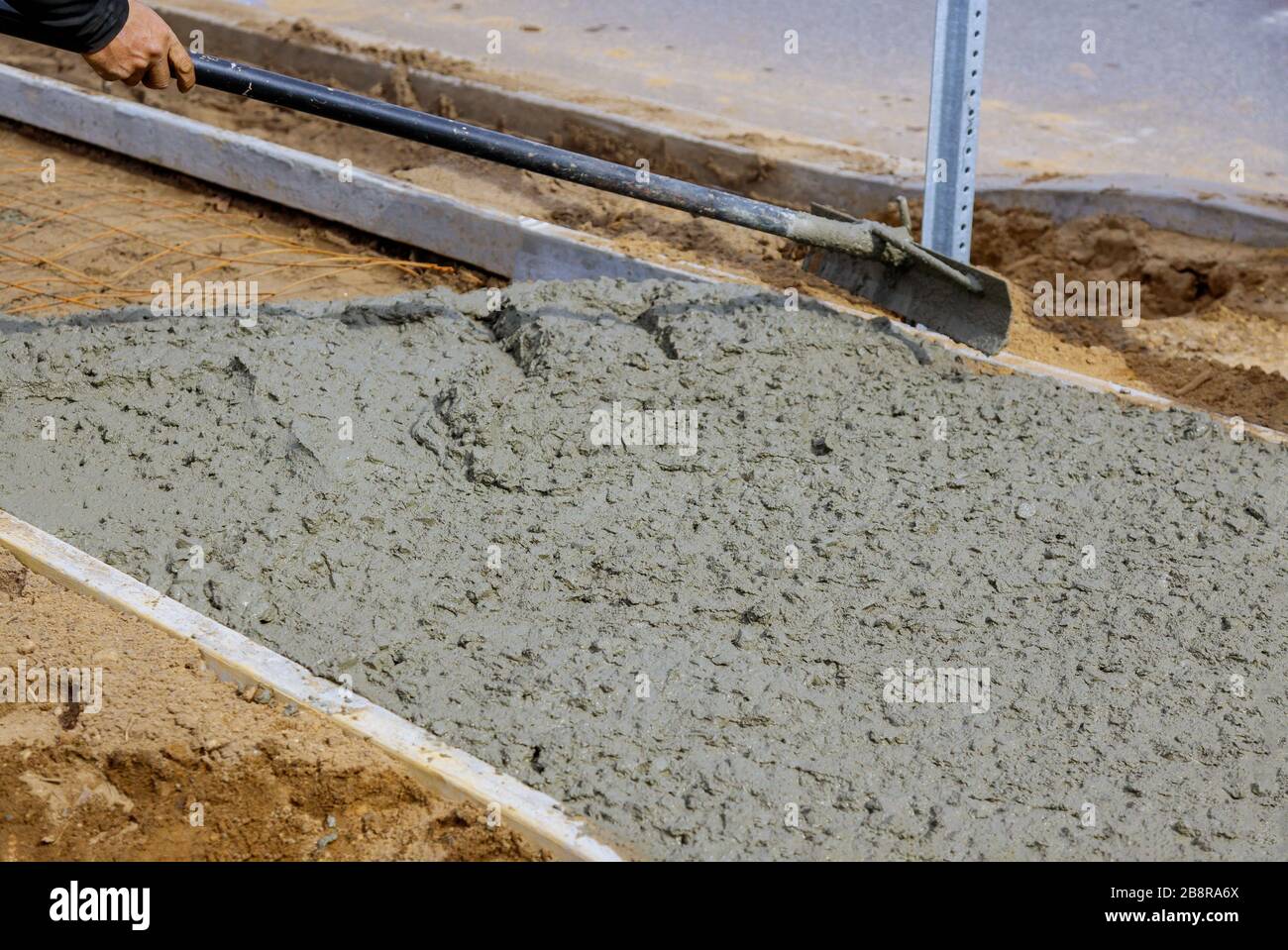 Making of a freshly poured cement on urban sidewalk Stock Photo Alamy