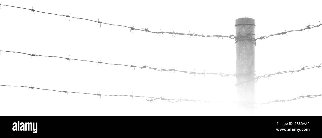 black and white deliberately burnt out image of barbed barb wire fences meeting at a corner post. Stock Photo