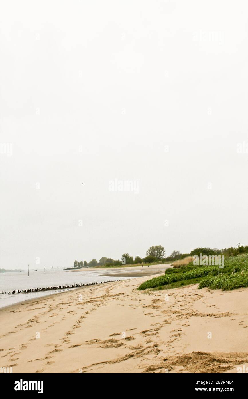 Rough and cold Weser beach in Brake Unterweser Lower Saxony Germany