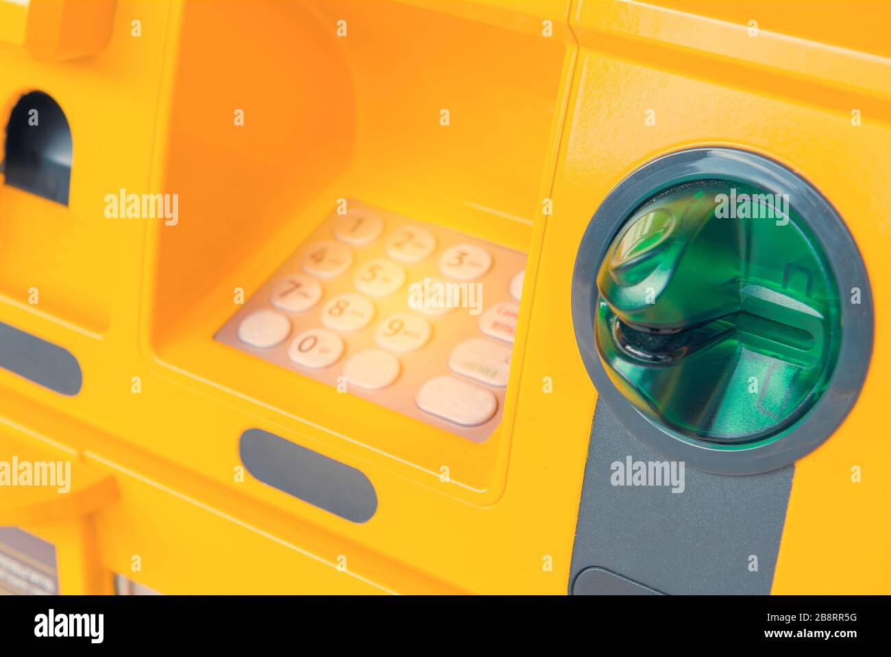 Hand insert credit card to ATM bank cash machine for withdraw money. Stock Photo