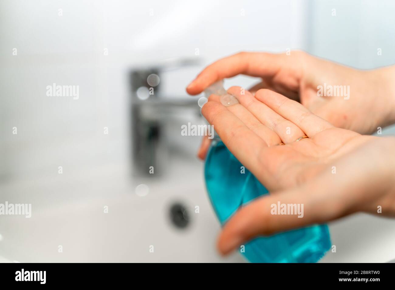 Woman washing her hands at home with antibacterial soap Stock Photo - Alamy