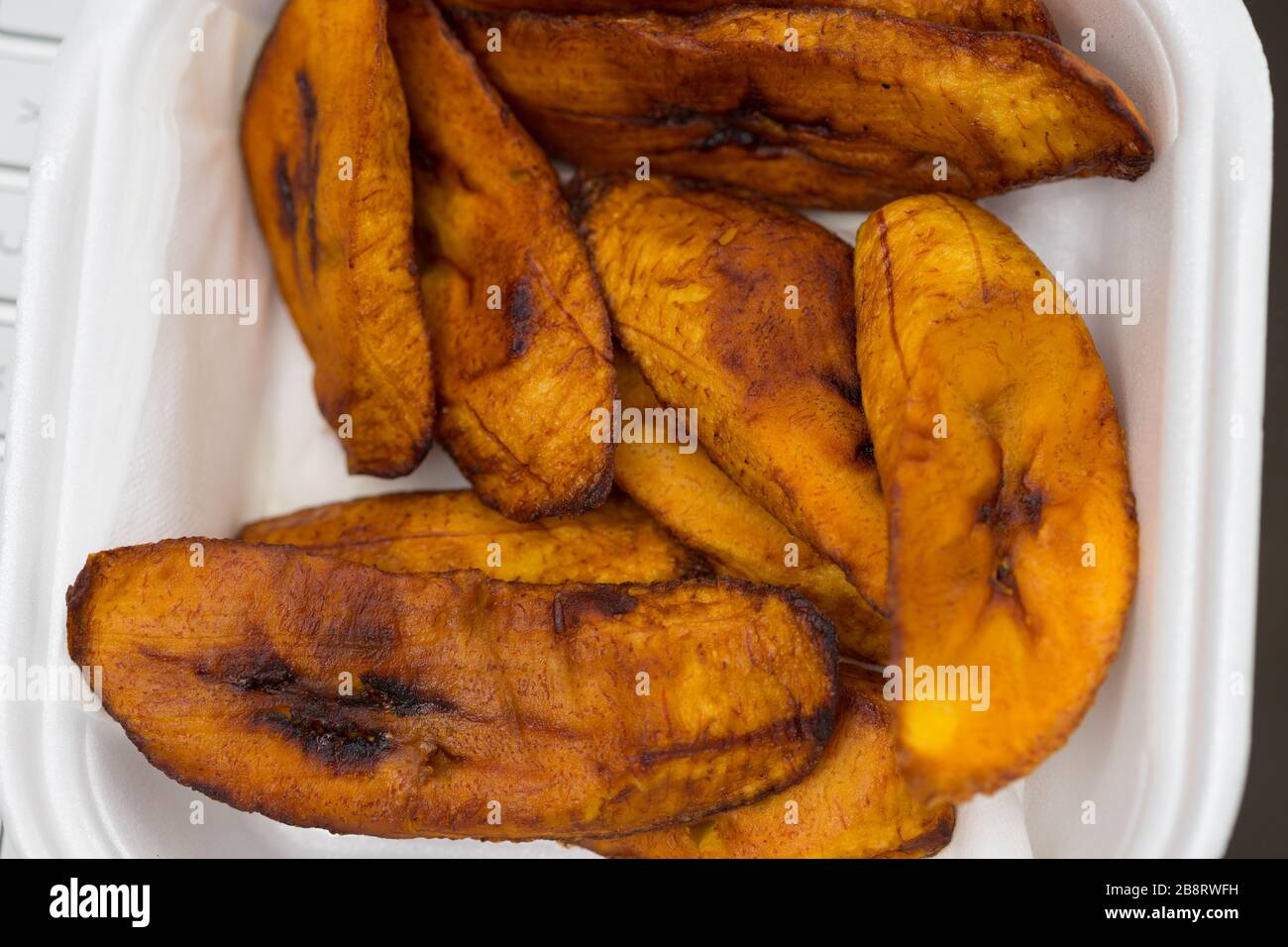 Fried ripe plantains, popular breakfast staple in Caribbean & Central American countries. Stock Photo