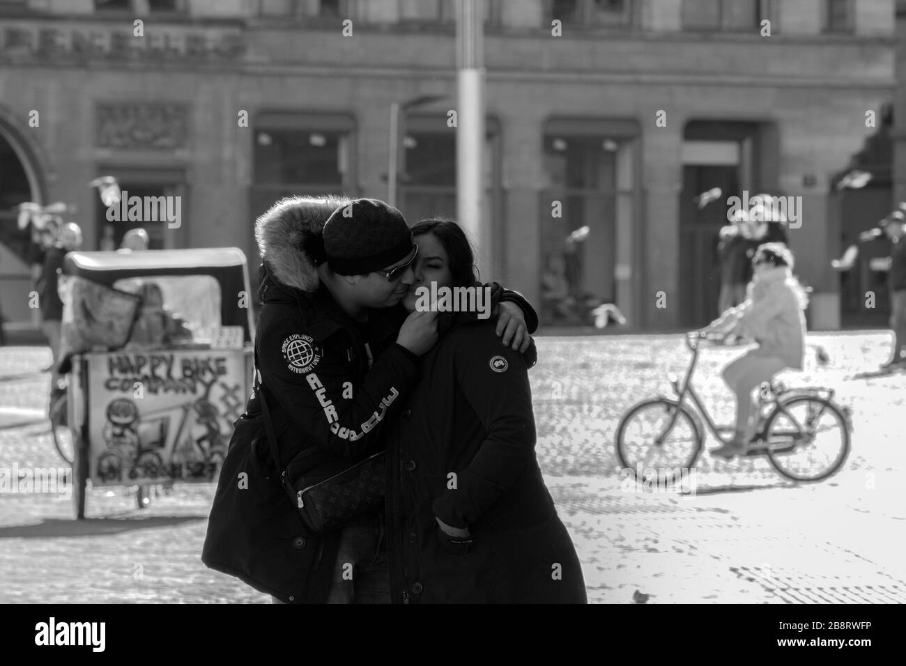 Is Kissing Safe During The Coronavirus Outbreak At Amsterdam The Netherlands 2020 In Black And White Stock Photo