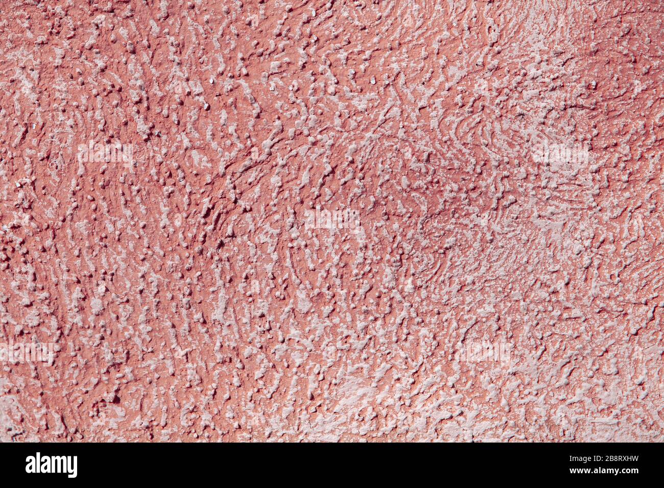 Pink smoothie. The texture of a single wall. Putty laid in chaotic ...