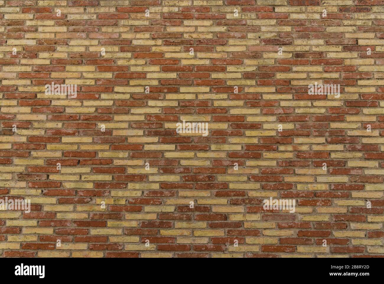 Traditional Spanish brick wall pattern, background, and texture Stock