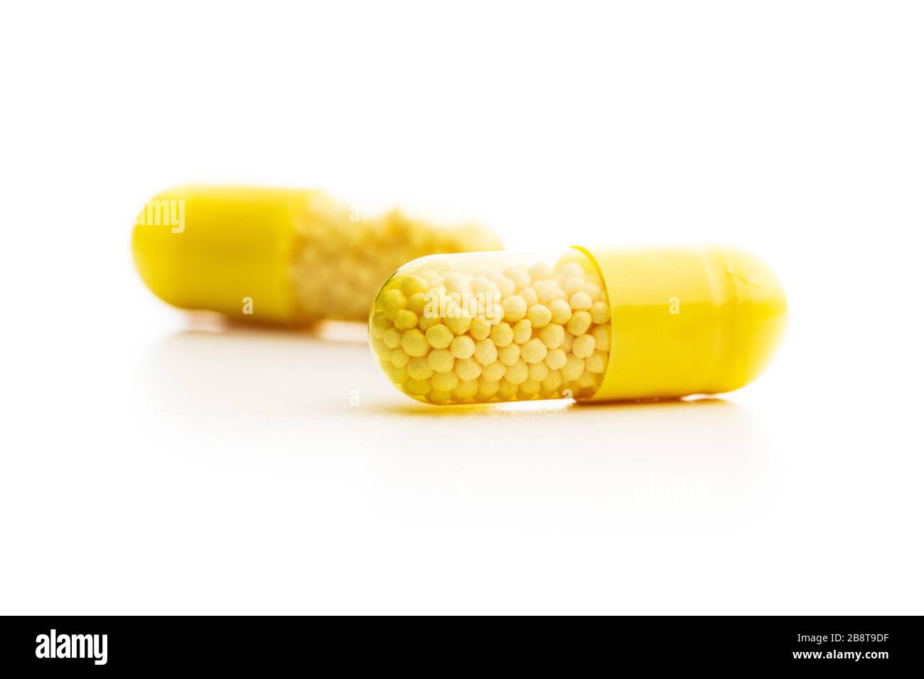 Vitamin capsules. Vitamin C pills isolated on white background. Stock Photo