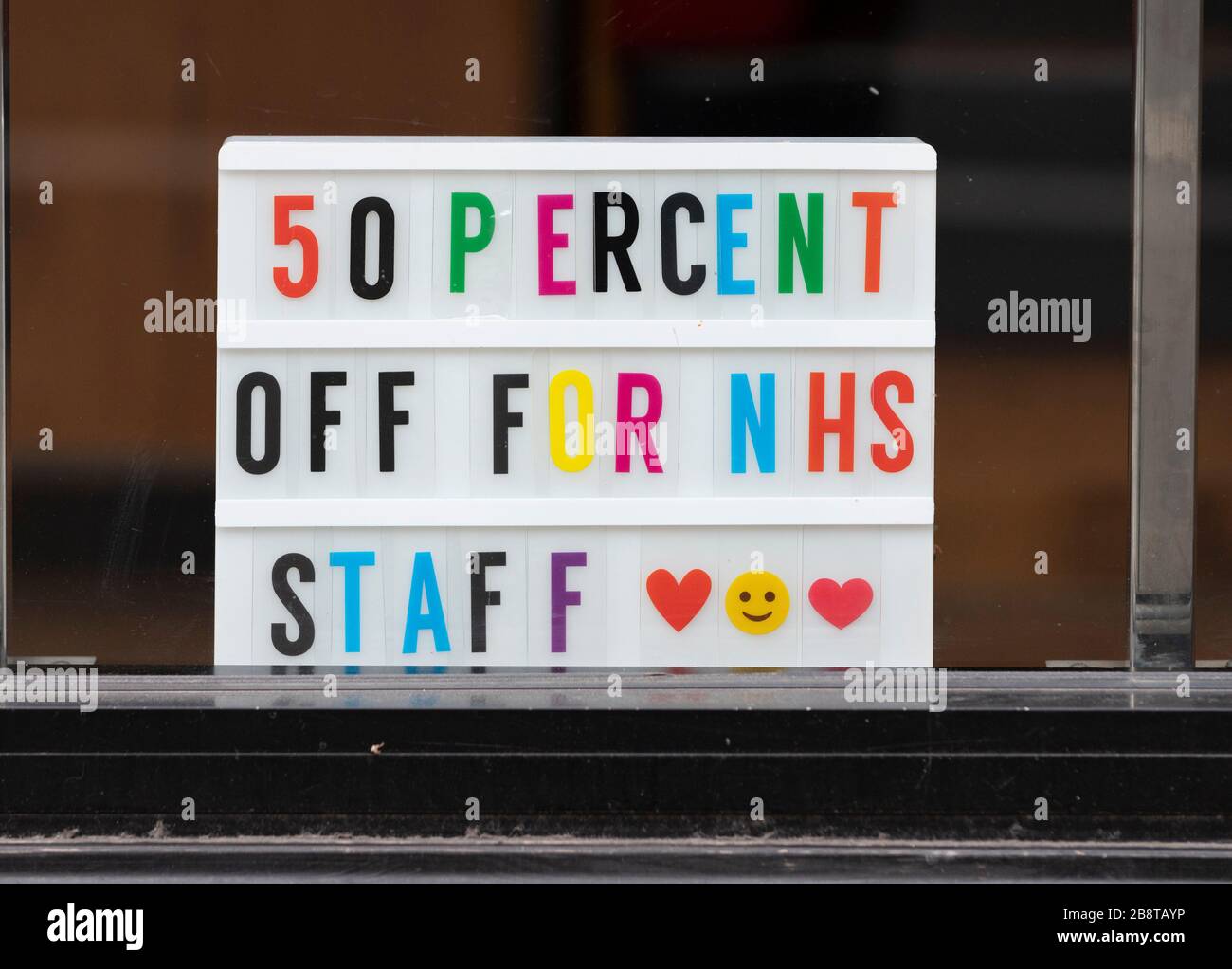 Edinburgh, Scotland, UK. 23 March 2020. Sign in restaurant window offering 50 percent reduction for NHS staff in Edinburgh. Iain Masterton/Alamy Live News. Stock Photo